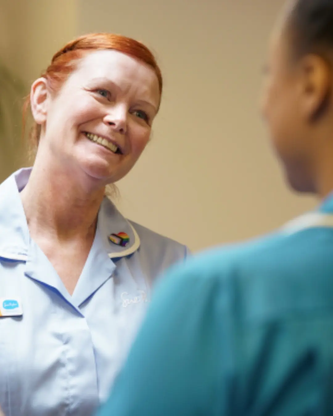 Two nurses in conversation 