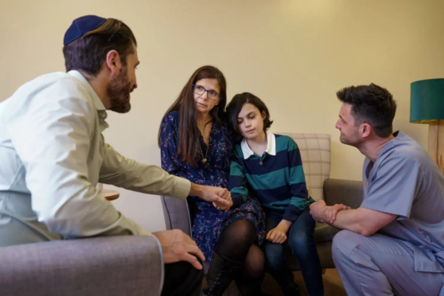 Healthcare professional supporting a family