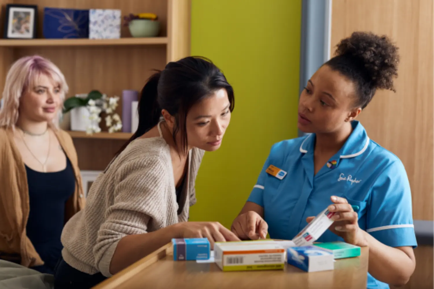 Healthcare professional discussing medication with patient