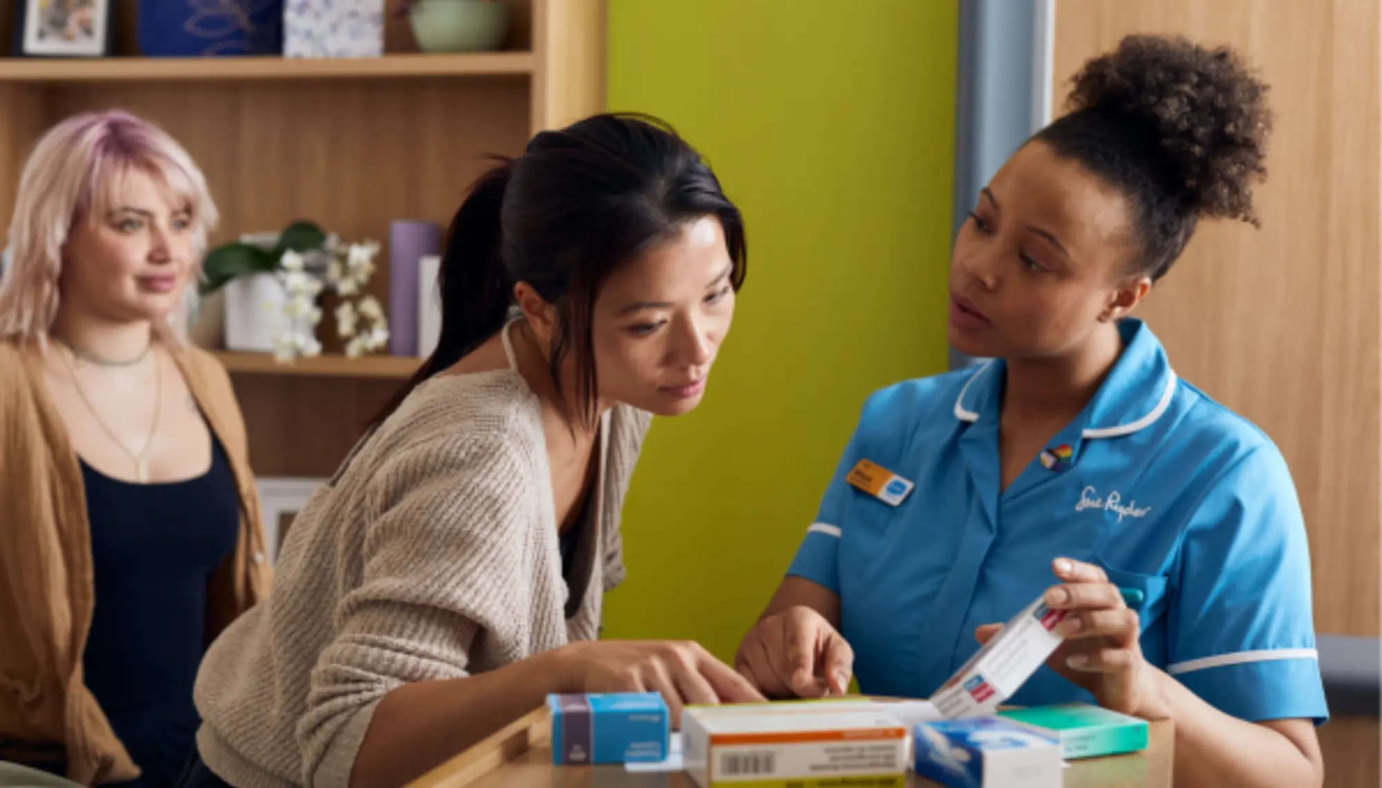 Healthcare professional discussing medication with patient