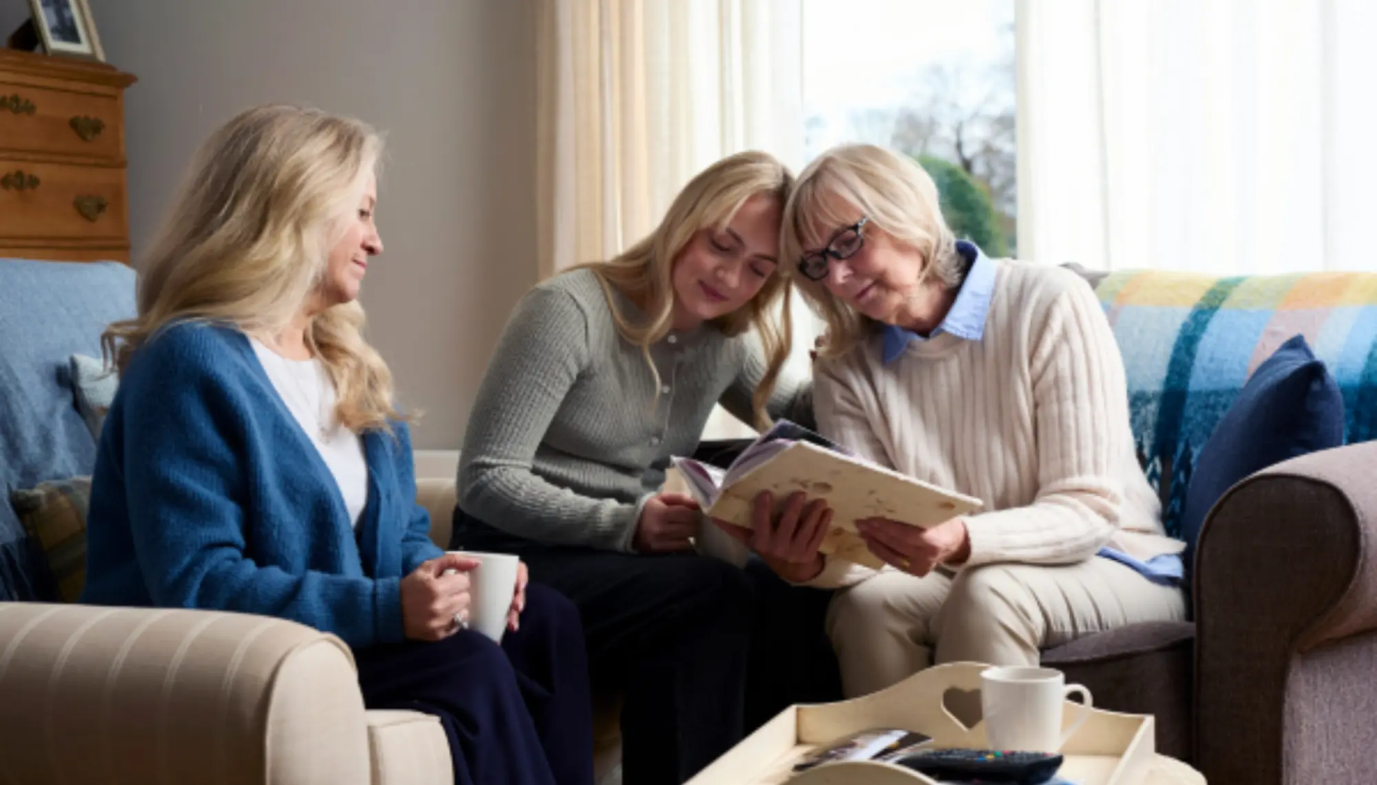 Family looking through photo album