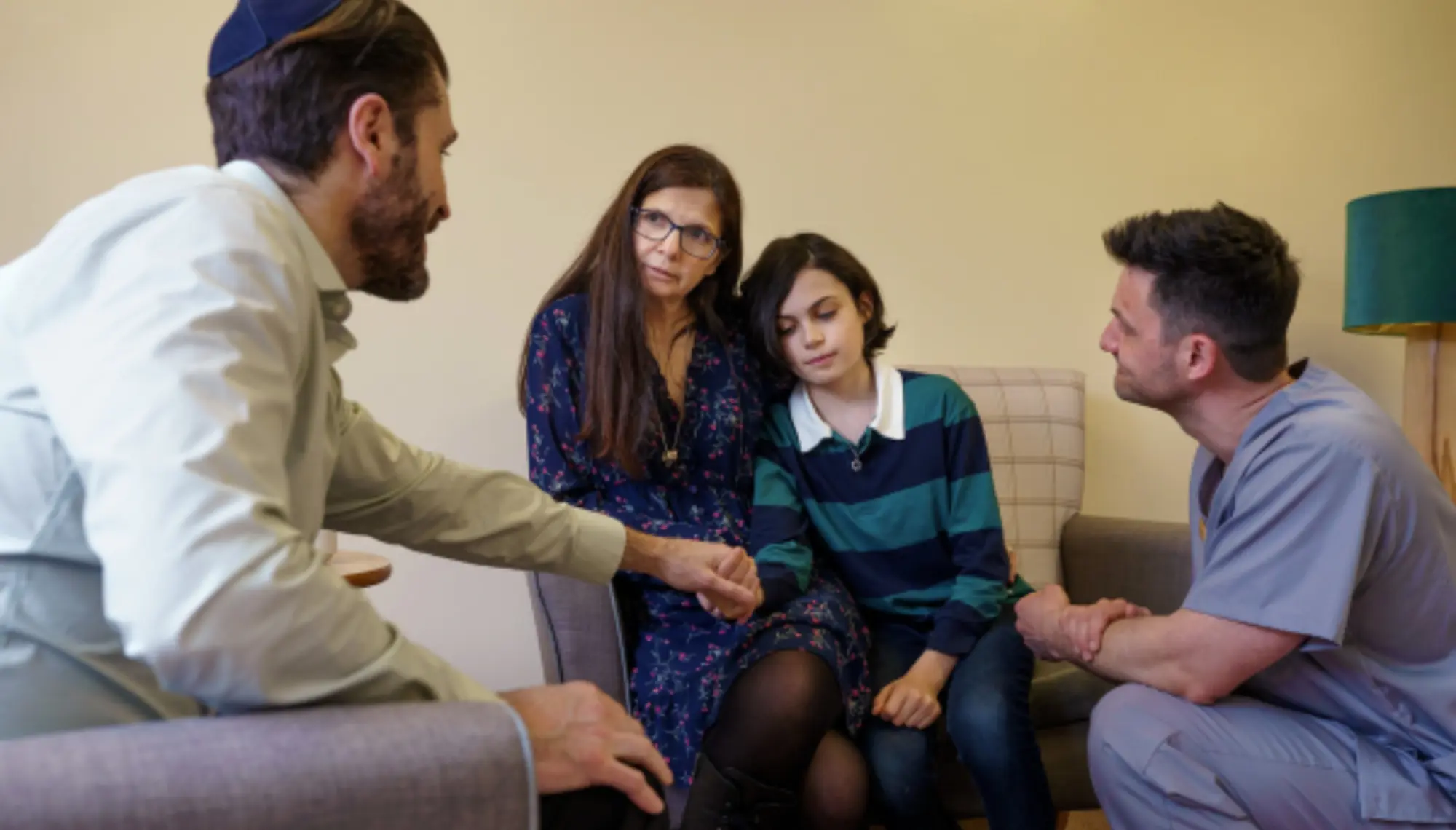 Healthcare professional supporting a family