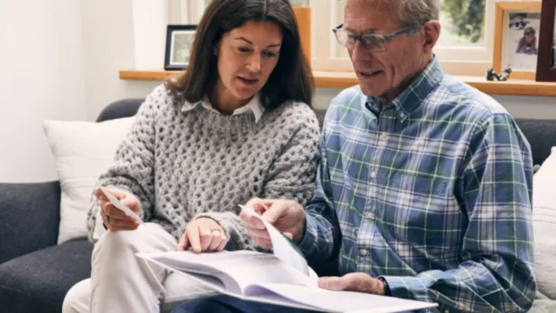 Pair looking through photos