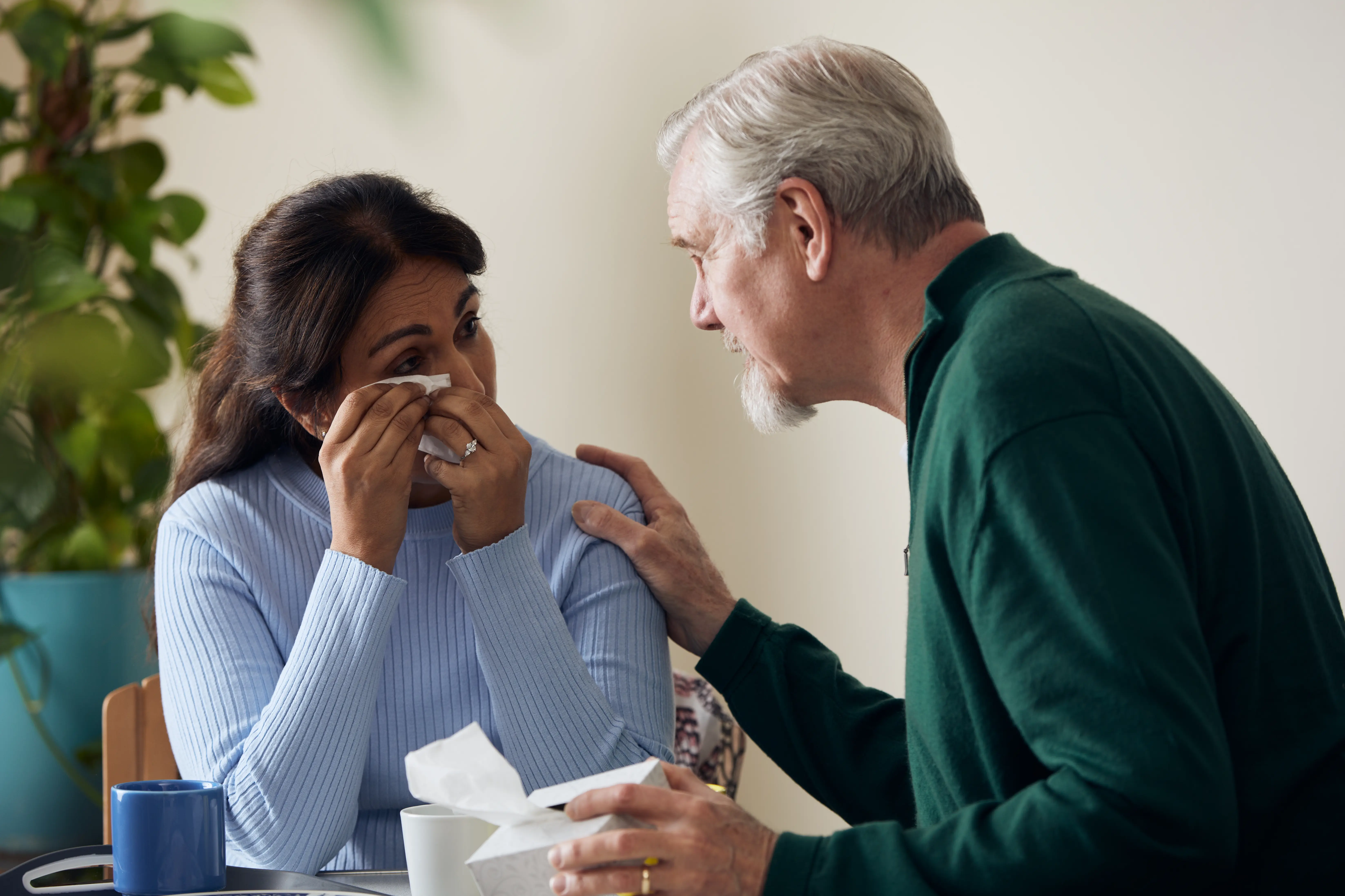 Crying woman comforted 
