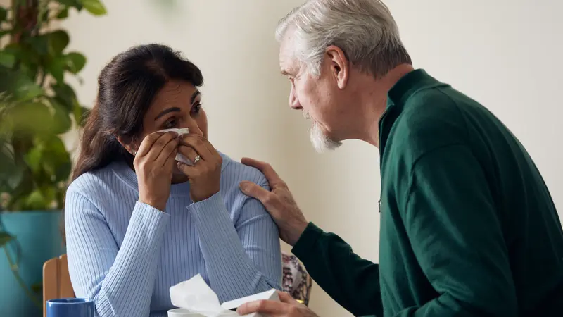 Crying woman comforted 