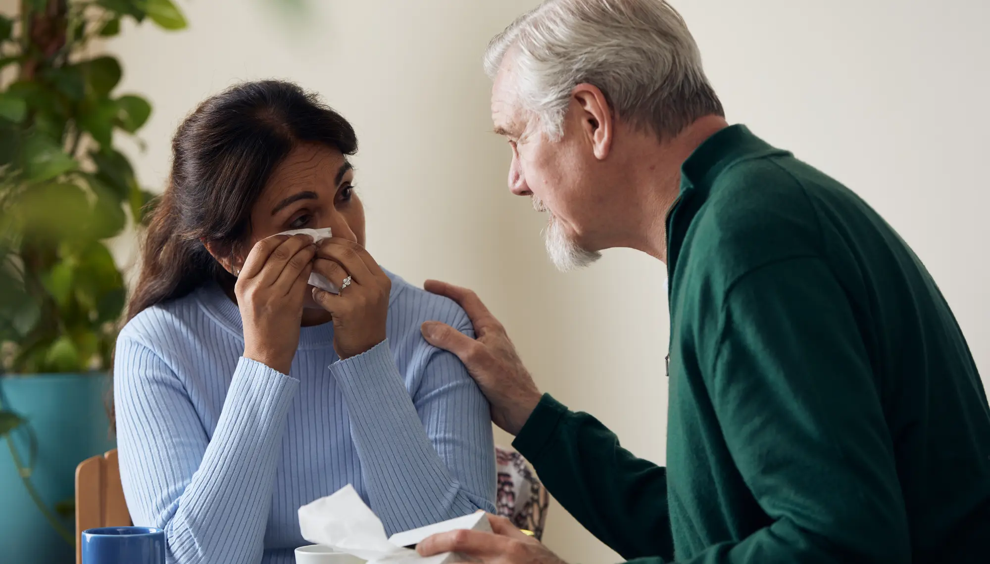Crying woman comforted 